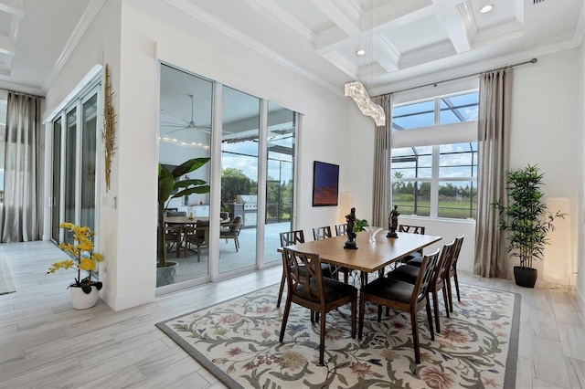 dining room featuring crown molding and light hardwood / wood-style flooring