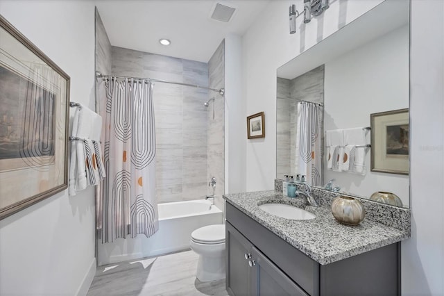 full bathroom with vanity, toilet, and shower / bath combination with curtain