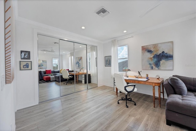 office area featuring crown molding and light hardwood / wood-style floors