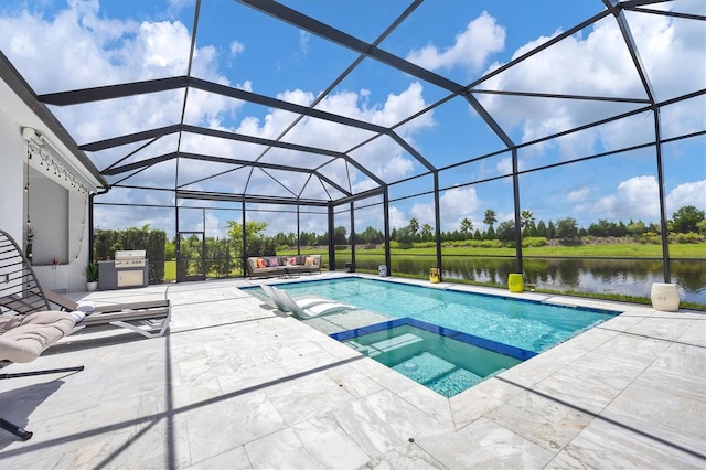 view of pool featuring a water view, a lanai, a patio, and an in ground hot tub