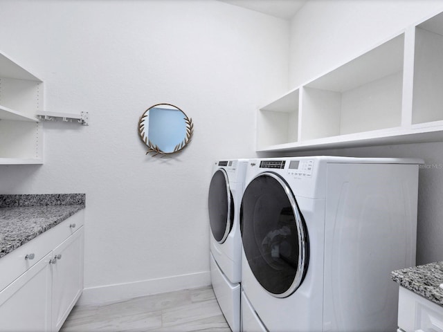 washroom with separate washer and dryer and light wood-type flooring