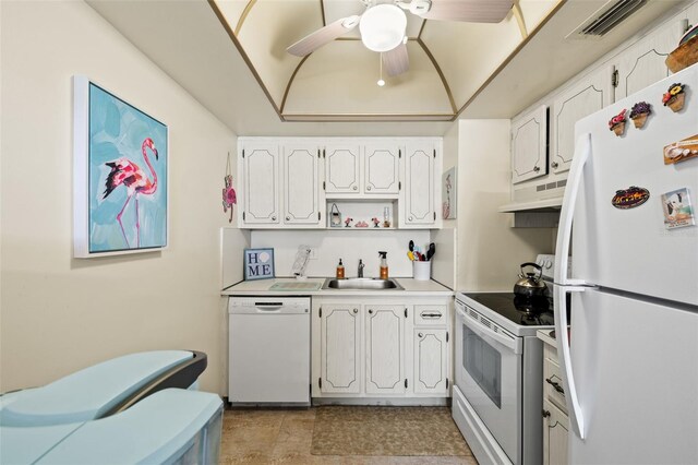 kitchen featuring white appliances, sink, light tile patterned flooring, white cabinetry, and ceiling fan