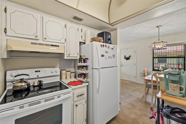 kitchen with white appliances, pendant lighting, premium range hood, white cabinetry, and a chandelier