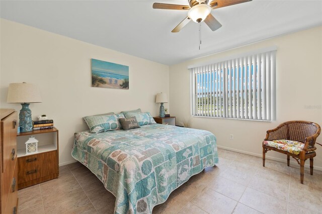 bedroom featuring light tile patterned flooring and ceiling fan