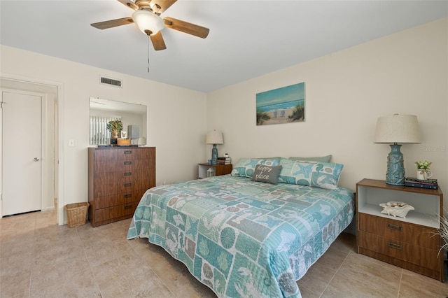 bedroom with light tile patterned flooring and ceiling fan