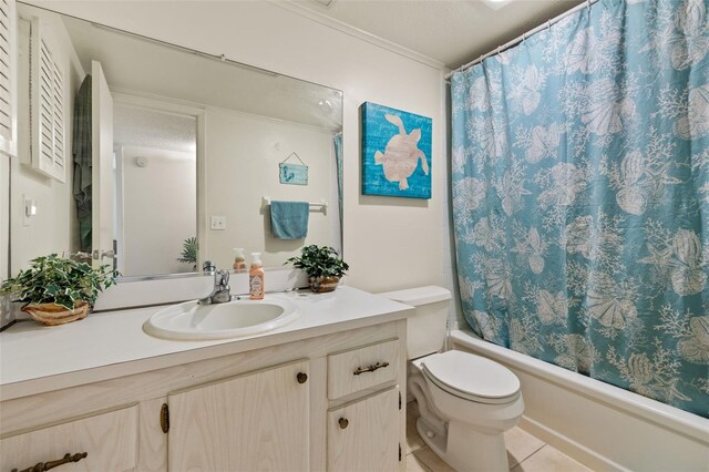 full bathroom with tile patterned flooring, shower / tub combo with curtain, toilet, vanity, and ornamental molding