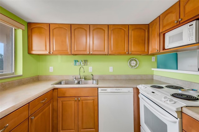 kitchen with sink and white appliances