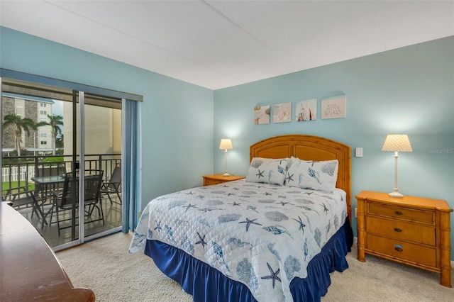 carpeted bedroom featuring access to outside