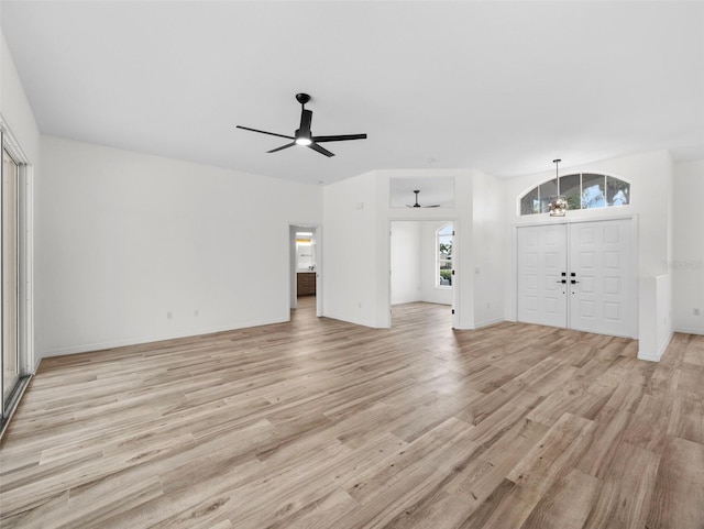 unfurnished living room featuring light hardwood / wood-style flooring and ceiling fan