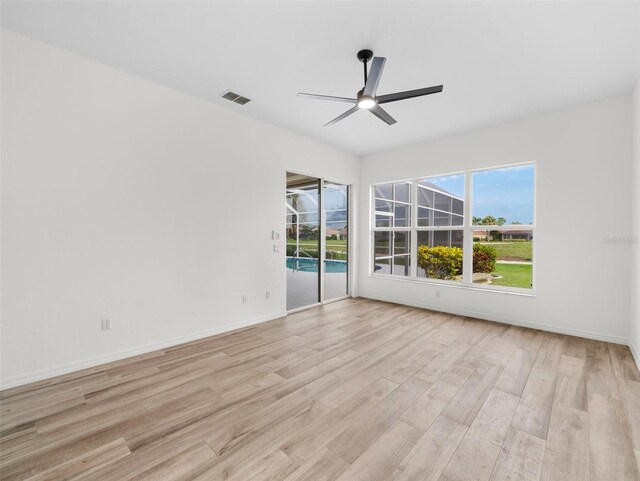 unfurnished room with light hardwood / wood-style flooring and ceiling fan