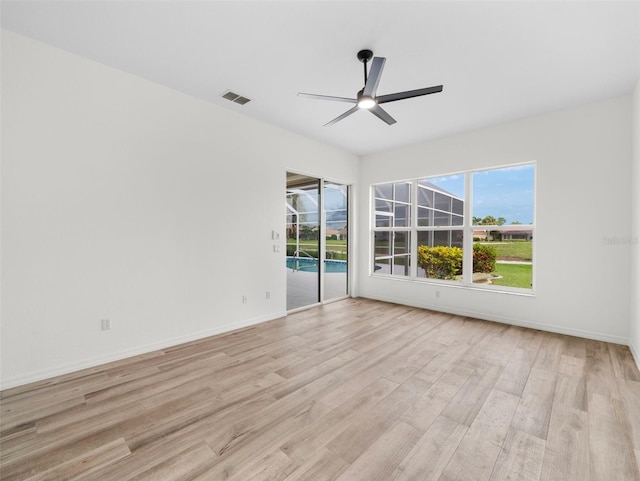 spare room featuring ceiling fan and light wood-type flooring