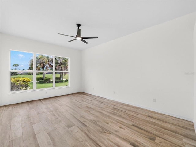 spare room with light hardwood / wood-style flooring and ceiling fan