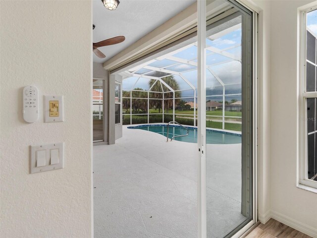 view of pool featuring ceiling fan