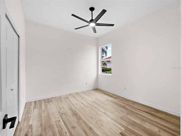 unfurnished bedroom featuring ceiling fan, light hardwood / wood-style floors, and a closet