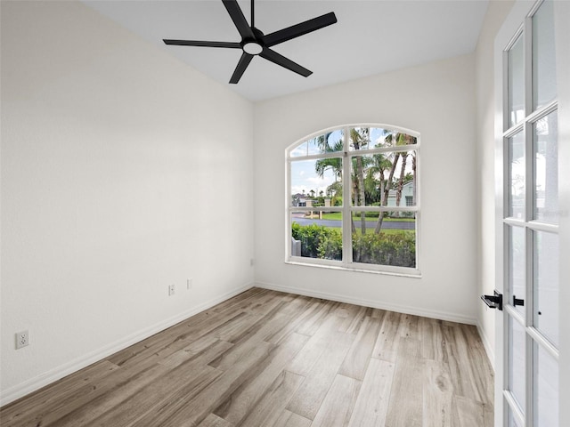 unfurnished room with ceiling fan and light hardwood / wood-style flooring