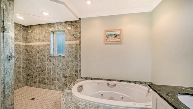 bathroom with ornamental molding, separate shower and tub, and vanity