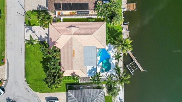 birds eye view of property with a water view