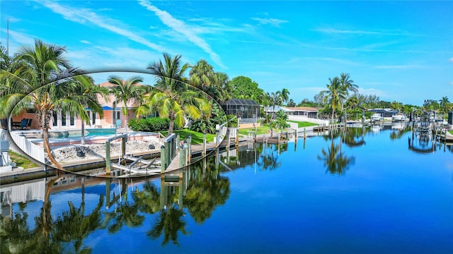 dock area with a lanai and a water view