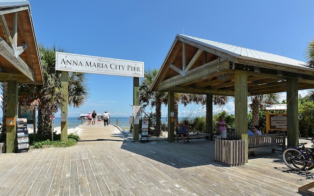 view of property's community featuring a gazebo, a water view, and a view of the beach