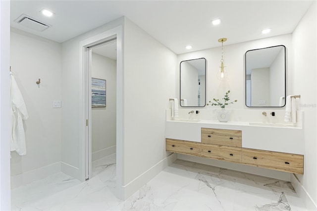 bathroom with dual vanity and tile patterned flooring