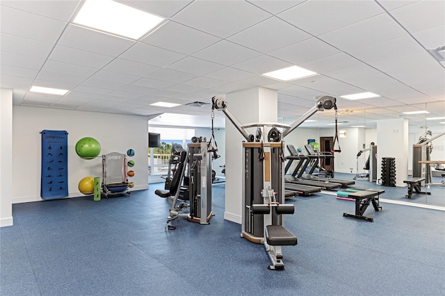 workout area with a paneled ceiling