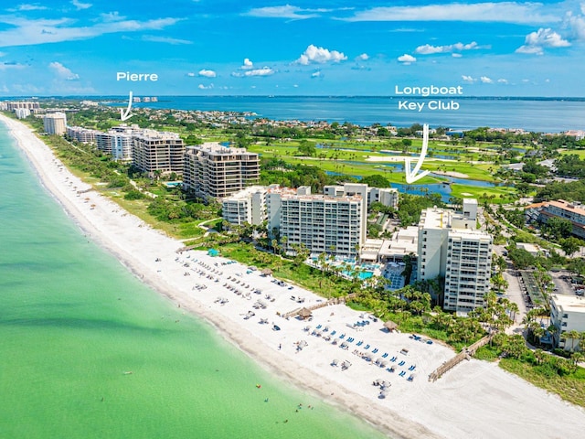 bird's eye view featuring a view of the beach and a water view