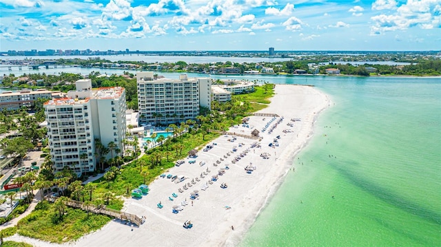 bird's eye view with a water view and a beach view