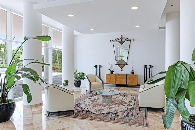 interior space featuring light tile patterned flooring and floor to ceiling windows