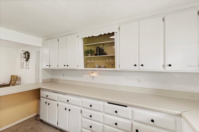 kitchen featuring white cabinets