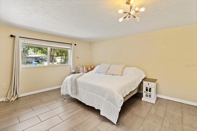 bedroom with a notable chandelier