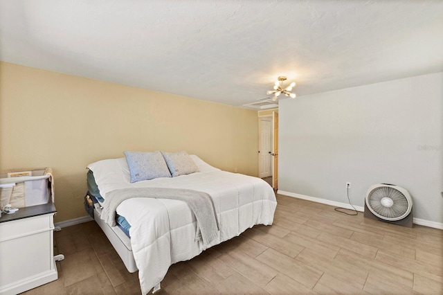 bedroom with a notable chandelier