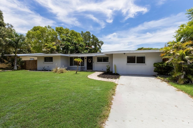 single story home with a front yard