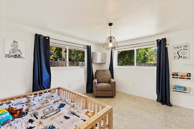 bedroom with a nursery area