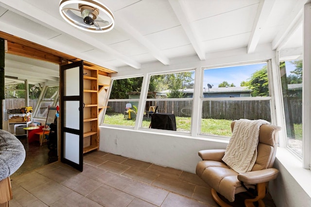 sunroom with beamed ceiling