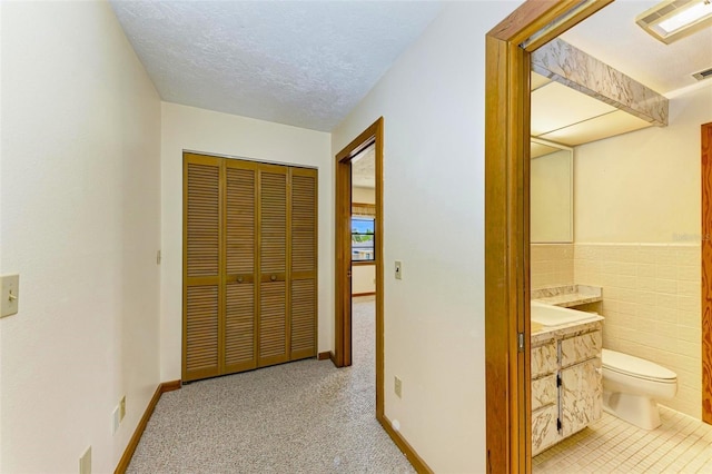 5111 Coral Blvd, Bradenton, FL 34210 - hall featuring a textured ceiling and baseboards