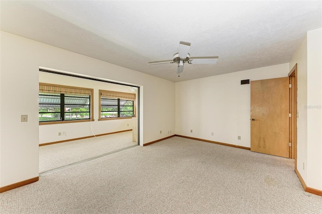 5111 Coral Blvd, Bradenton, FL 34210 - empty room featuring light colored carpet, baseboards, and ceiling fan