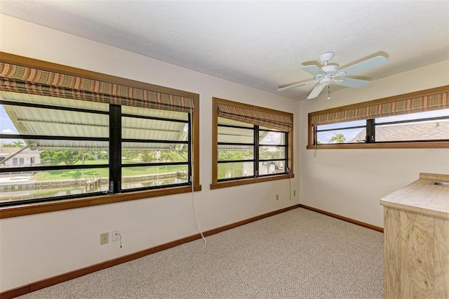 5111 Coral Blvd, Bradenton, FL 34210 - spare room with light carpet, baseboards, and a ceiling fan
