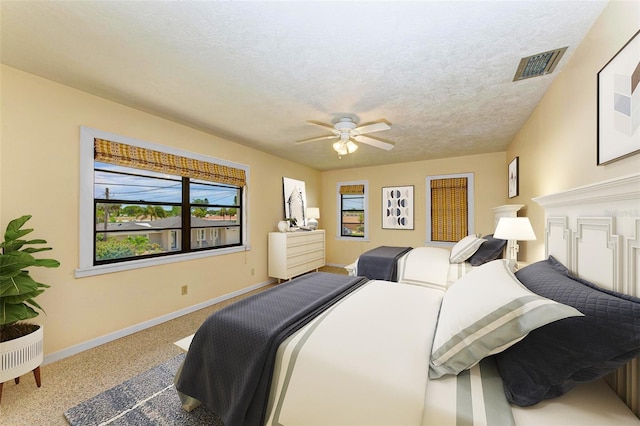 5111 Coral Blvd, Bradenton, FL 34210 - bedroom with baseboards, carpet, a textured ceiling, and ceiling fan