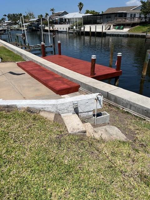 5111 Coral Blvd, Bradenton, FL 34210 - dock area with a water view, a residential view, and boat lift