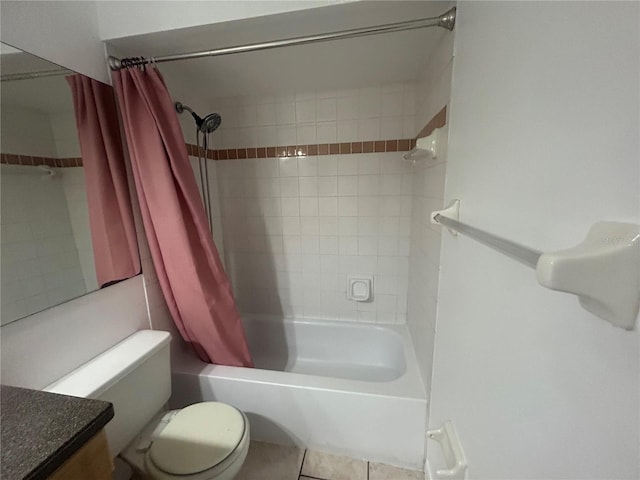 bathroom with shower / tub combo, vanity, toilet, and tile patterned floors