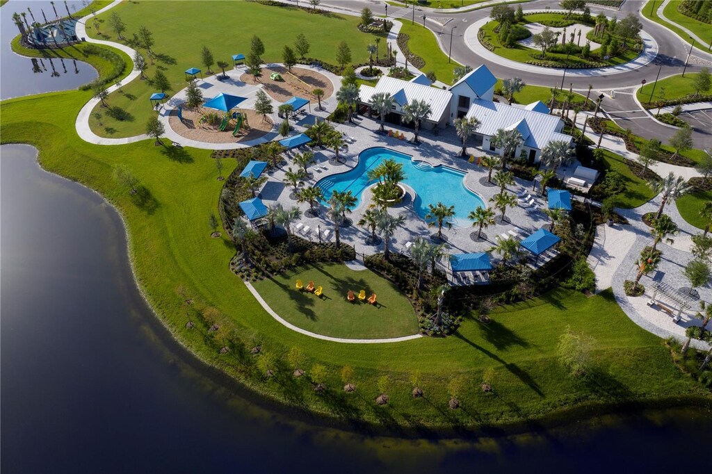 birds eye view of property with a water view