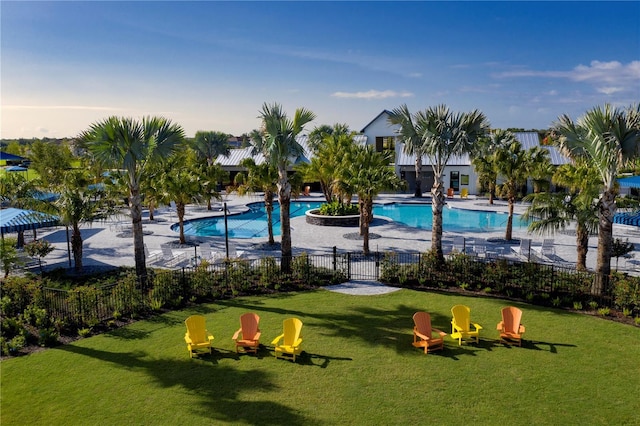 exterior space featuring a pool and a yard