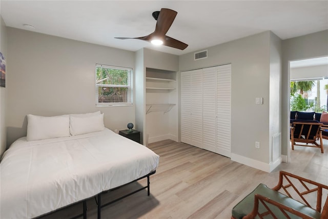 bedroom featuring a closet, ceiling fan, and light wood-type flooring