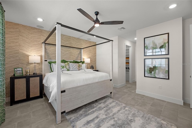 bedroom featuring light tile patterned floors and ceiling fan