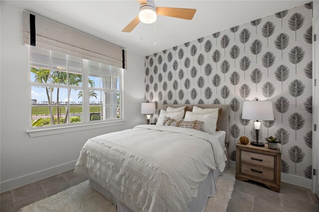 bedroom with tile patterned flooring and ceiling fan