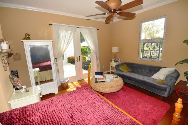 living room featuring wood-type flooring, crown molding, french doors, and ceiling fan