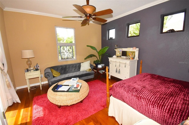 bedroom featuring ceiling fan, wood-type flooring, and ornamental molding