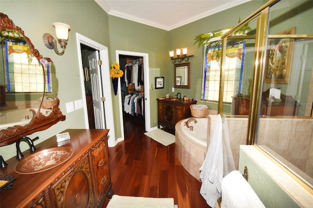 bathroom with separate shower and tub, hardwood / wood-style floors, vanity, and ornamental molding