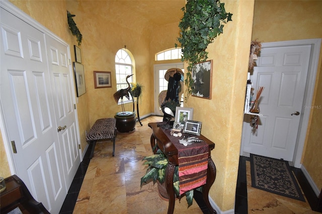 hallway with tile patterned floors