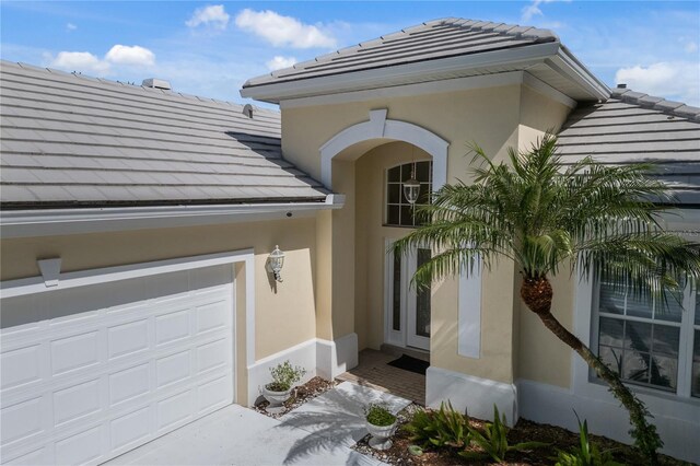 entrance to property featuring a garage